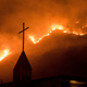 Flames from a wildfire advance down a hillside near the Springs of Life Church in Casitas Springs, CA, on Tuesday, Dec. 5, 2017. (Image: AP)